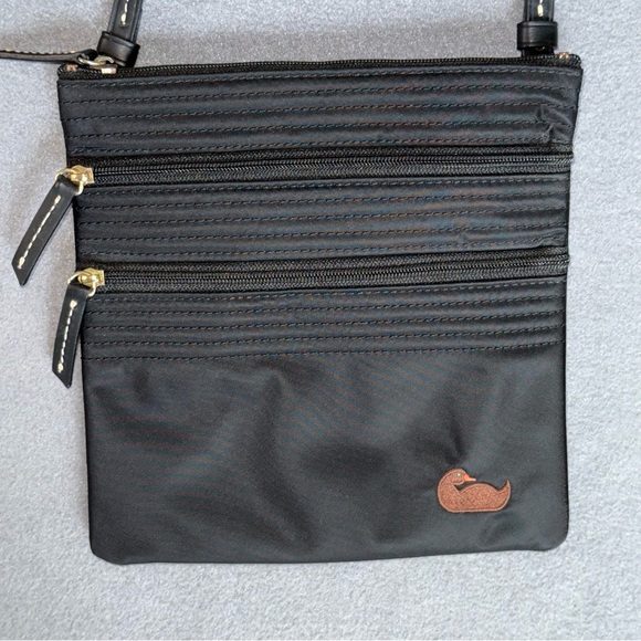 Dooney & Bourke Handbags - Dooney & Bourke Black Nylon Small Crossbody Bag Hot pink inside 3 zip pockets